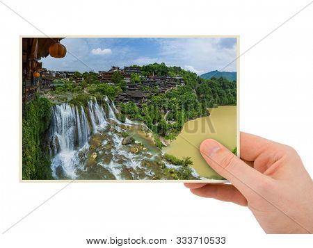 Hand and Furong ancient village and waterfall - Hunan China (my photo) isolated on white background
