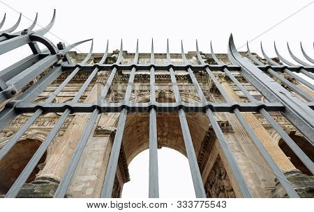 High Iron Railing Of Protection To The Arch Of Constantine The Famous Moumento In Rome In Italy