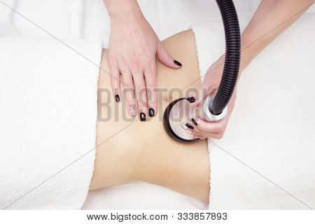 Procedure Removing Cellulite On Female Abdomen, Cavitation Belly Massage. Ultrasonic Massage For Wei