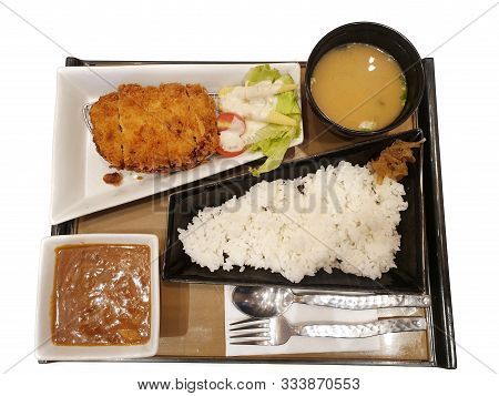 Japanese Food Style, Top View Of Sliced Pork Cutlet With Vegetable Salad, Curry, Rice And Miso Based