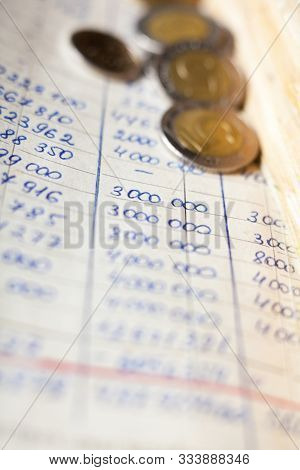 Hand-written Calculations And Coins. Bookkeeping (accounting). Economy. Financial Themes. Money Savi