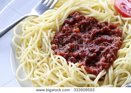 Spaghetti With Tomato Sauce And  Minced Meat. Spaghetti With Tomato Sauce On A White Plate.