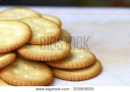 Biscuits Are Stacked On The Wooden Table With Selective Focus.