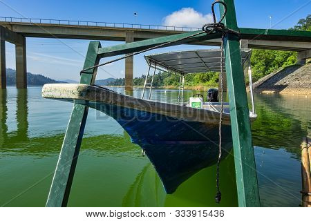 Fiber Speed Boat Floating Near The Boathouse.boat Is Main Transportation At Banding Lake Located In