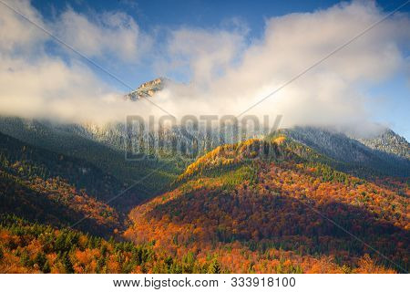 Autumn On Mount Ceahlau With Toaca Peak In Dense Fog Located In Piatra Neamt, Romania