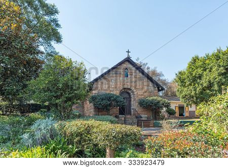 Sabie, South Africa - May 21, 2019: A Street Scene, With The Saint Peters Anglican Church, In Sabie