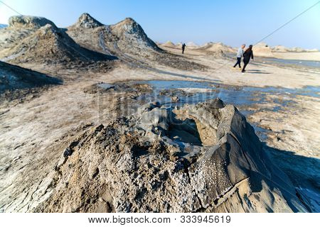 Mud Volcano With Tourist In Background In Gobustan National Park ,azerbaijan.bubbling Crater Of A Mu