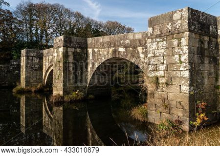 Brandomil Roman Stone Bridge Reflected On The Water In Zas, A Coruña, Spain