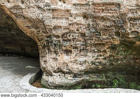 Gutmanis cave (Gutman's cave) is a landmark with inscriptions in sandstone from 17th century. Gauja national park. Sigulda, Latvia