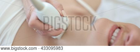 Doctor Conducts Ultrasound Examination Of Thyroid Gland Of Woman