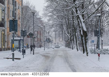 Winter Attack - Traffic On The Streets Of A Snow Covered Winter City