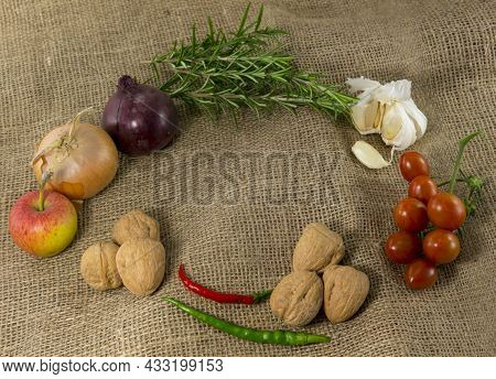 Frame Of Different Ingredients Foods Vegetables And Herbs With Space In The Middel For Text On Jute 