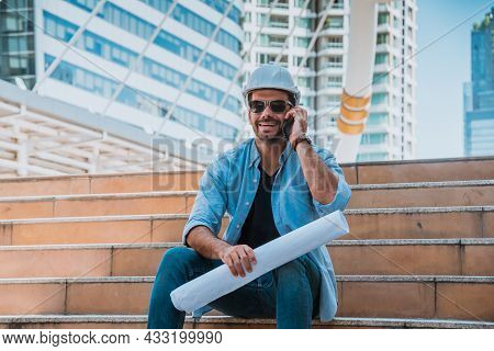 Engineer Wearing Sun Glass Look At Project Blueprints For Thinking About Building Project And How To