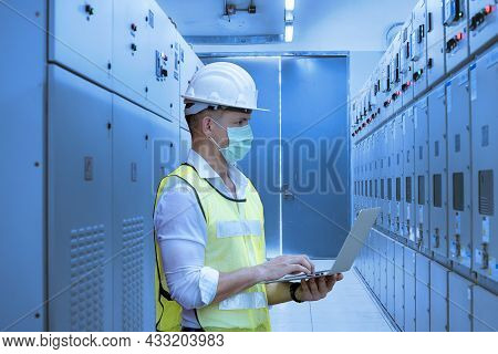 Worker Checking And Inspecting At Mdb Panel ,working With Electric Switchboard To Check Range Of Vol