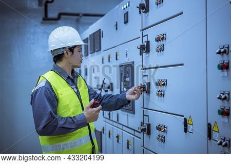 Engineer Checking And Inspecting At Mdb Panel .he Working With Electric Switchboard To Check Range O
