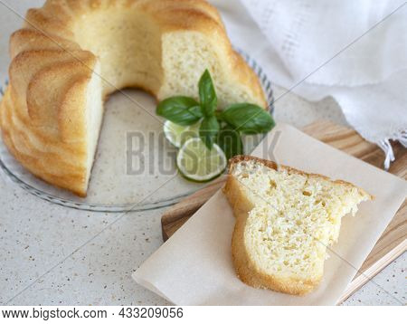 Piece Of Freshly-baked And Syrup Soaked Ring Cake. Sweet Neapolitan Rum Baba. Still Life With Pastry