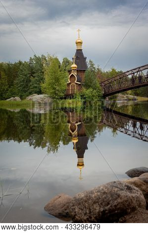 The Wooden Church Of St. Andrew The First-called On The Vuoksa River, A Beautiful Church On A Small 