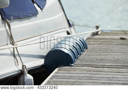 Long Pier Blue Fenders For A Boat And Dockside For Protection. Maritime Fenders