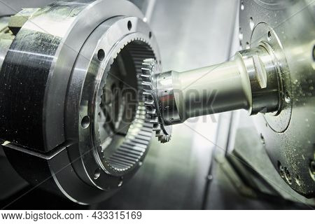 gear skiving operation on cnc machine in metalworking industry. Cutting tool makes internal tooth with mill