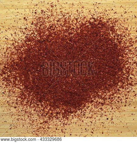 Ground Organic Aromatic Sumac Texture On Bamboo Cutting Board