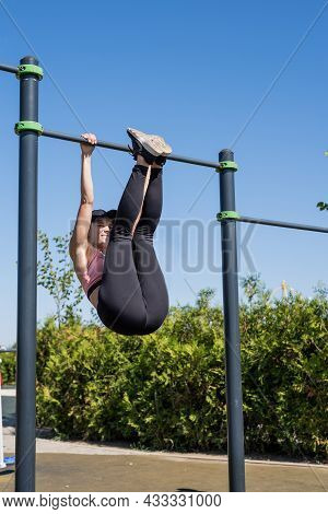 Sportive Woman Working Out On The Sports Ground In Sunny Summer Day