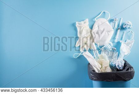 Covid-19 Plastic Waste And Garbage, Disposable Masks, Medicl Glove, Alcohol Gel Bottle And Needle In