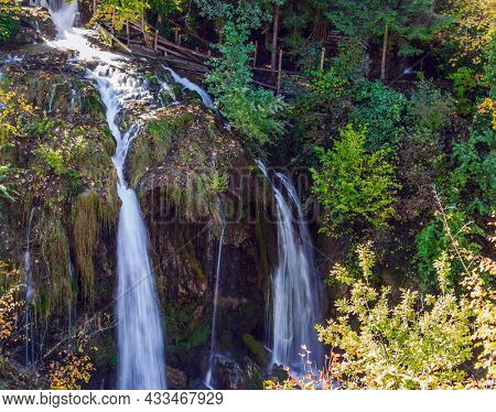 Magnificent forests surround the city and the river. Small waterfalls on the Korana River. Travel to Croatia. Wonderful  day. The town of Slunj. The concept of ecological, active and photo tourism