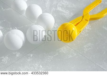 A Tool For Modeling And Making Snowballs From Snow For Children's Winter Games. Snowballs Lying On T