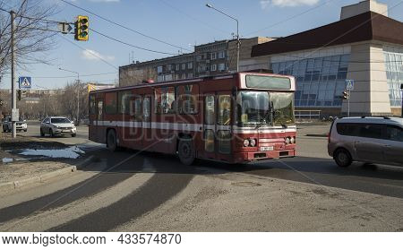 Kazakhstan, Ust-kamenogorsk, March 30, 2021: Traffic On One Of The Streets Of The City. Public Trans