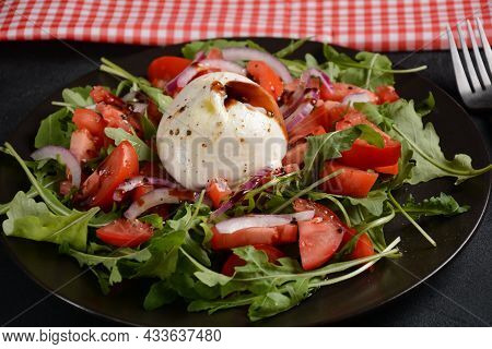 Salad With Tomatoes And Burrata Cheese With Basil And Olive Oil On Dark Background. Traditional Ital