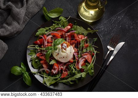 Salad With Tomatoes And Burrata Cheese With Basil And Olive Oil On Dark Background. Traditional Ital