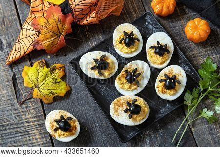 Halloween Funny Idea For Party Food. Halloween Creative Set Stuffed Eggs With Paprica And Bat On A W