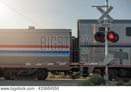 Crossing Crossbuck Sign. Closed Utah Railroad Crossing And Passing Train. Rail Theme.