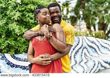 Young afircan american couple smiling happy and hugging at the city.