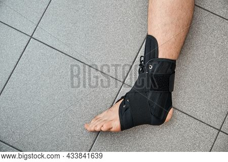 The Male Leg Is Fixed In A Medical Bandage. Ankle Fracture Or Sprain. Lacing And Tight Fit Of The Fo