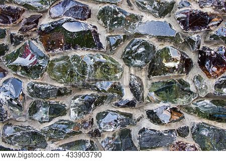 Glass Fiber Melt Multicolored Blocks Cemented On Facade Concrete Wall As Modern Architectural Decora