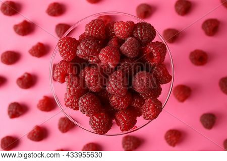 Red Juicy Raspberries In A Glass On A Pink Background With Raspberries
