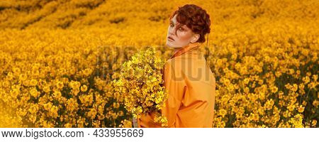 Portrait Of Red Haired Women Dressed In Trendy Fall Orange Trench Coat In Colourful Orange Field. Fa