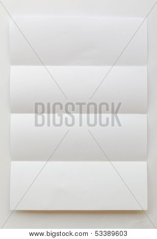 White Textured Sheet Of Paper Folded