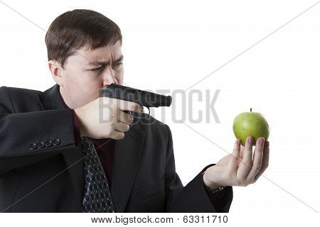 Man Aims At The Apple On His Hand