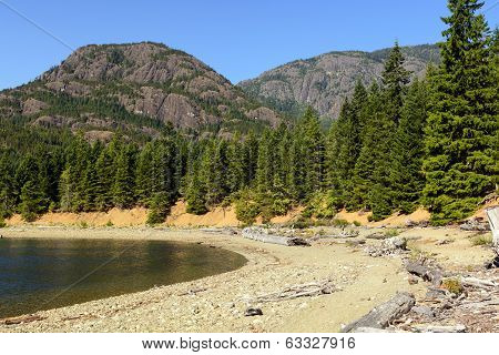 Granite Peaks Above A Placid Lake