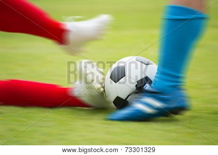 Soccer Player Striking The Ball