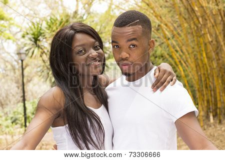 Fun Loving Black couple hugging each other