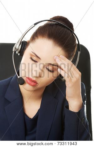 Portrait of anoyed support phone operator in headset