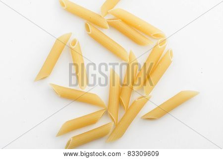 uncooked penne isolated on white background