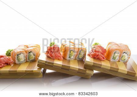 Sushi On A Wooden Plate Gete Isolated On White Background