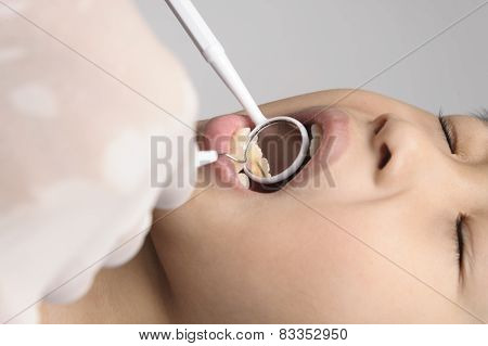 Boy Checking Tooth By Mirror