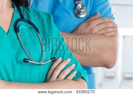 Two Doctors Standind With Their Arms Crossed On Chest