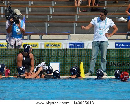 Budapest, Hungary - Jul 16, 2014. France's SAKELLIS Filippos head coach talking about the tactics. The Waterpolo European Championship was held in Alfred Hajos Swimming Centre in 2014.