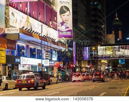 HONG KONG CHINA - OCT 22: Crowded street view at night on October 22 2015 in Hong Kong China. With 7M population and land mass of 1104 sq km it is one of the most dense areas in the world.